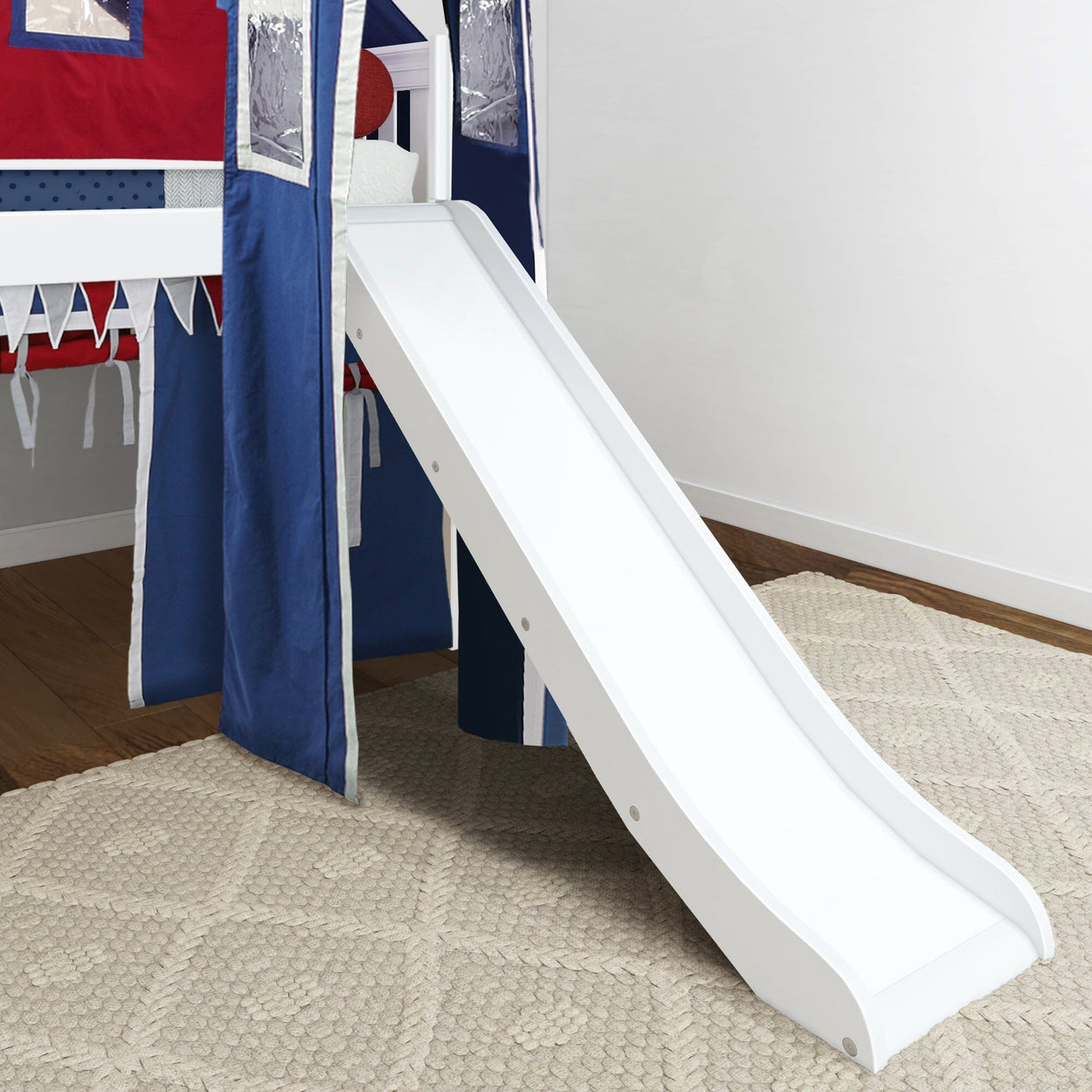 Children's loft bed with attached slide and blue and red tent on beige carpet flooring.