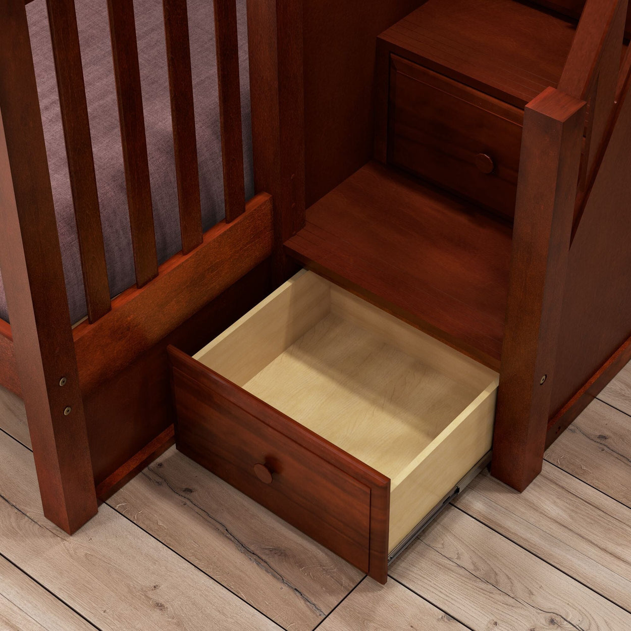 Wooden staircase with built-in storage drawer on a hardwood floor.