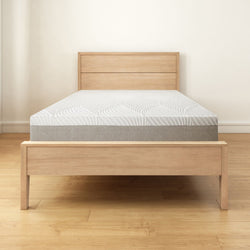 Modern wooden bed frame with comfortable mattress in minimalistic bedroom setting.