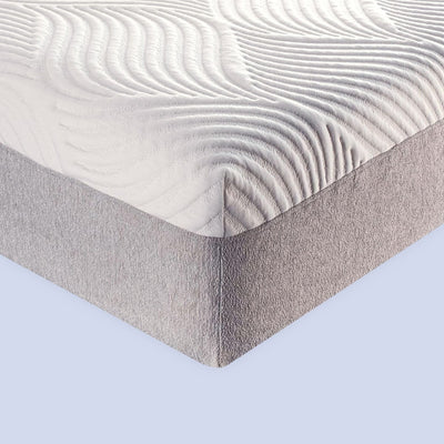 Memory foam mattress with a textured white cover and gray fabric base.