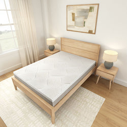 Modern bedroom with a stylish wooden bed frame and memory foam mattress, featuring bedside tables and elegant lamps.