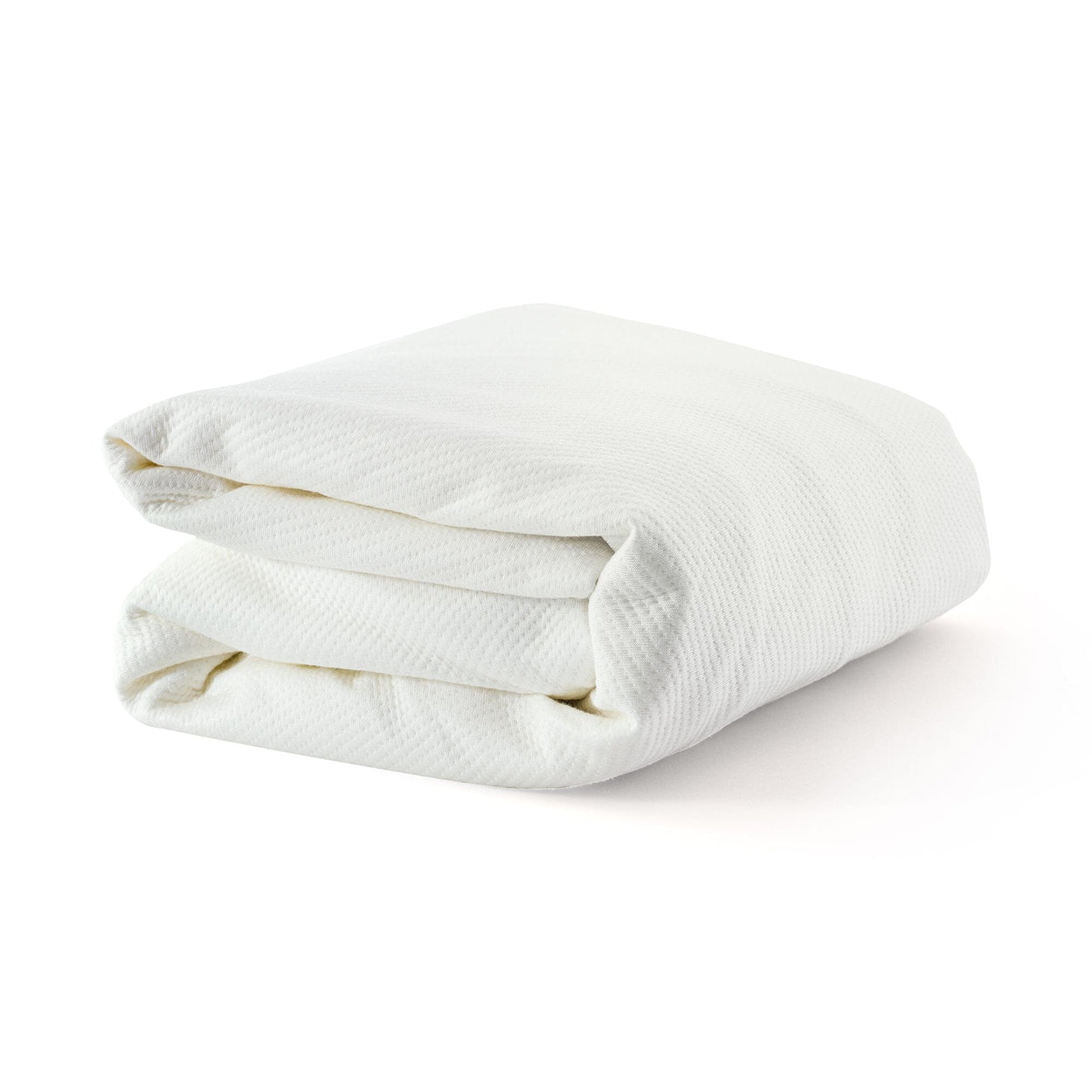 Folded soft white blanket on a plain background for cozy home decor.