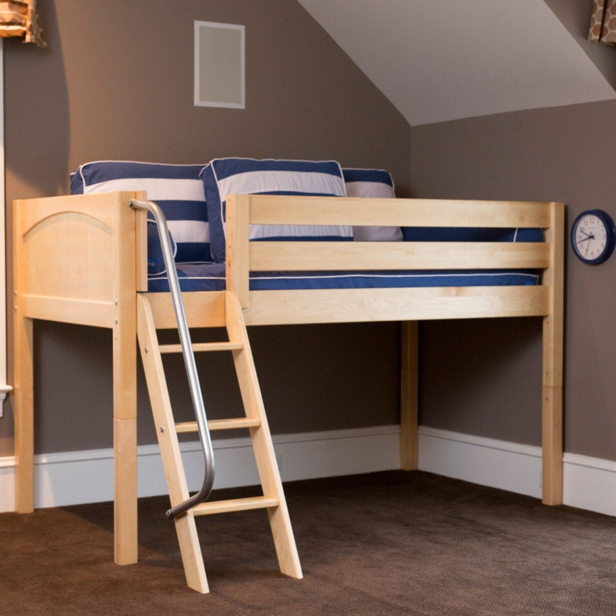 Loft bed with ladder and blue-striped bedding in modern gray bedroom.