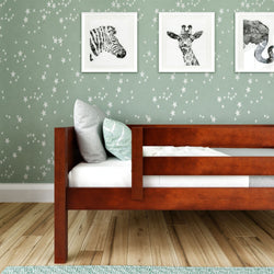 Modern kids bedroom with wooden bed, star-patterned wallpaper, and animal wall art.