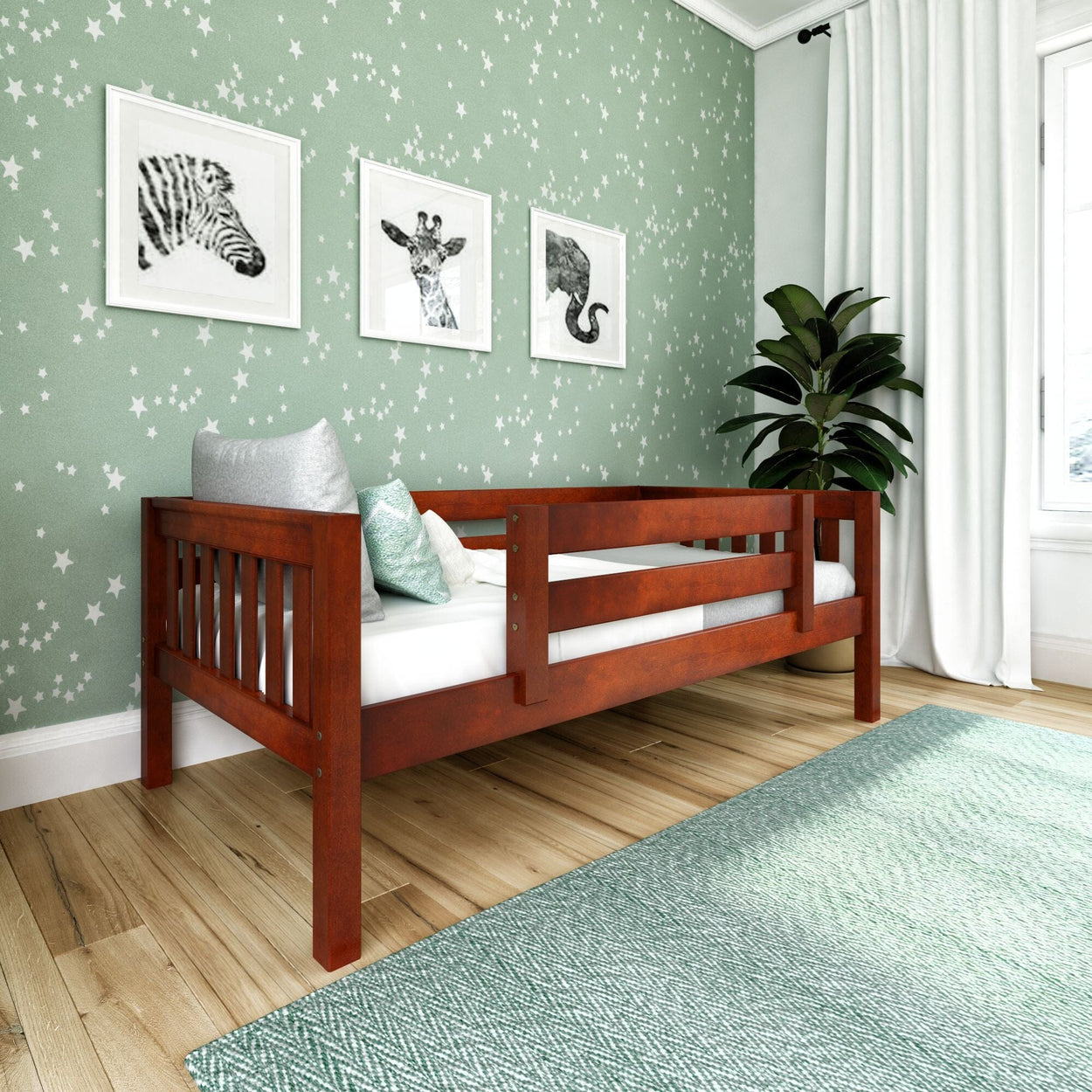 Toddler bed in a stylish children's room with animal prints and star-patterned wallpaper.