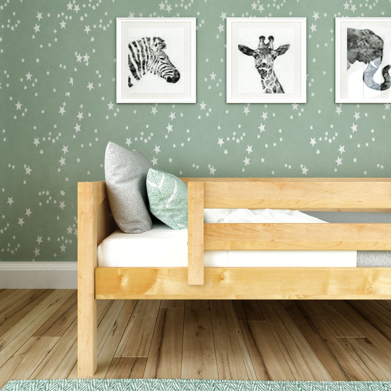 Wooden bed frame in children's room with star-patterned wallpaper and animal art prints.