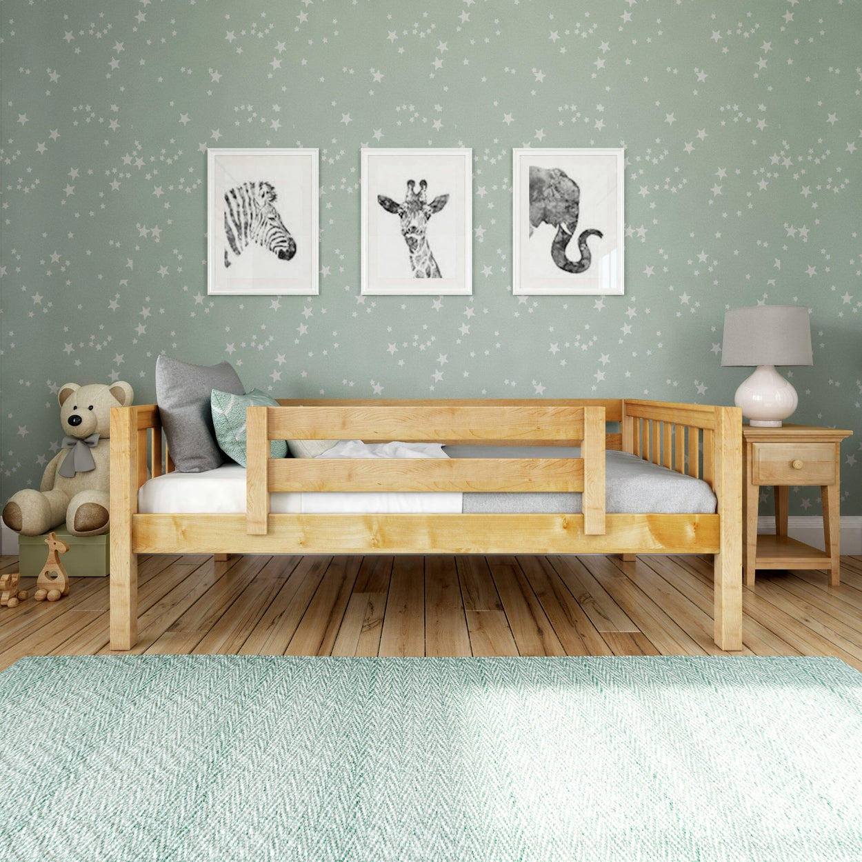 Kids' bedroom with wooden bed, animal wall art, star-patterned wallpaper, and stuffed bear.