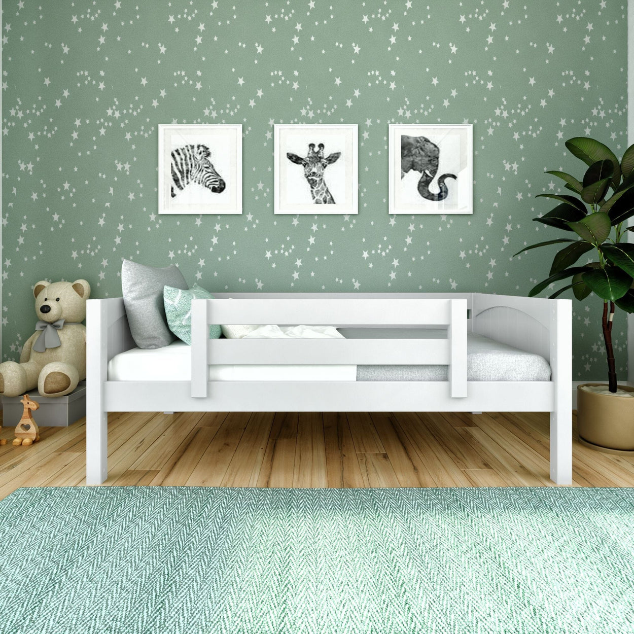 Children's bedroom with a white bed, star-patterned green wallpaper, framed animal art, and cozy decor.