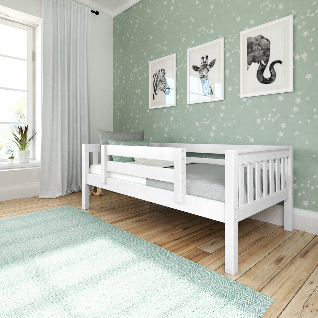Child's bedroom with white single bed, star-patterned wallpaper, and animal wall art.