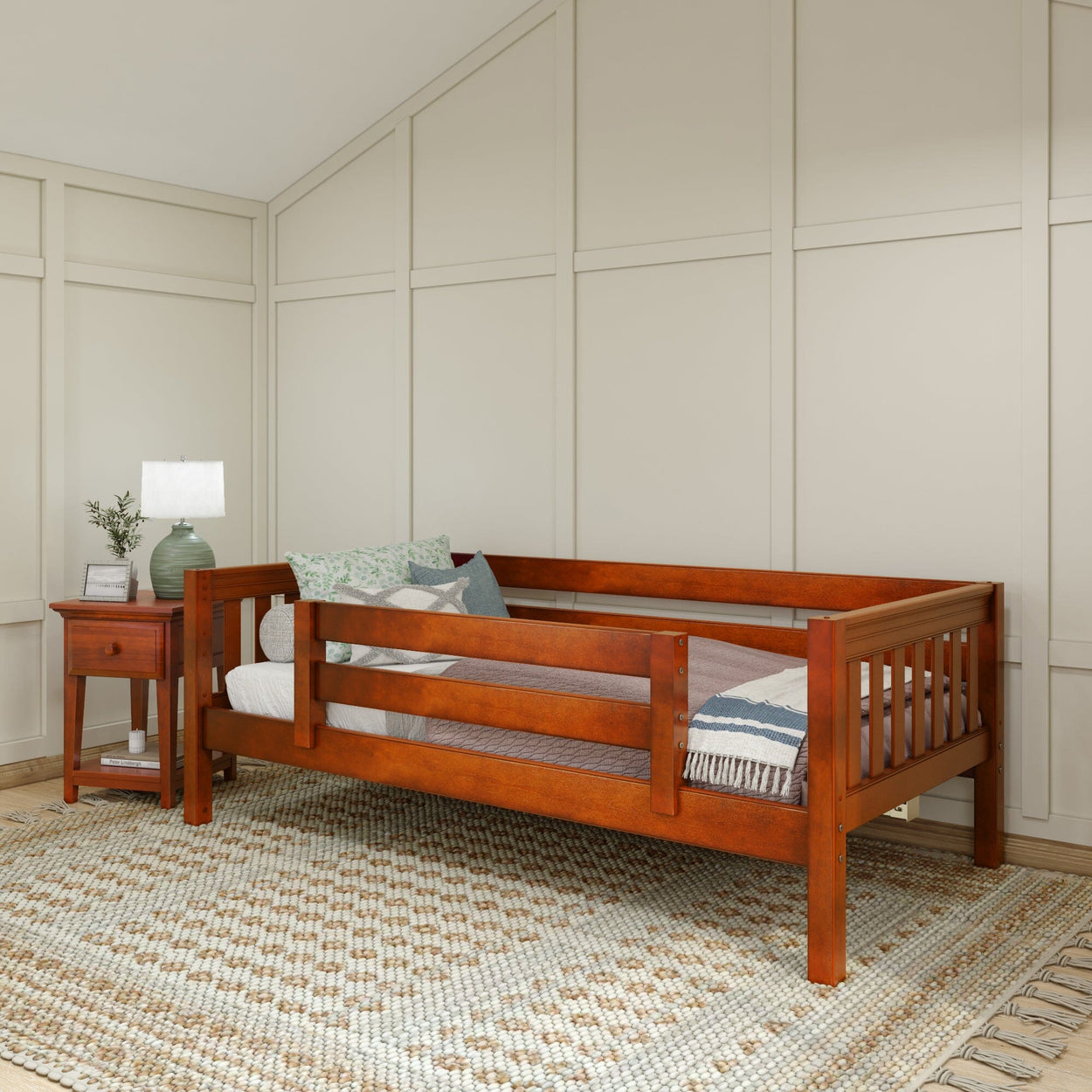 Wooden daybed with decorative pillows and a side table in a modern bedroom setting.