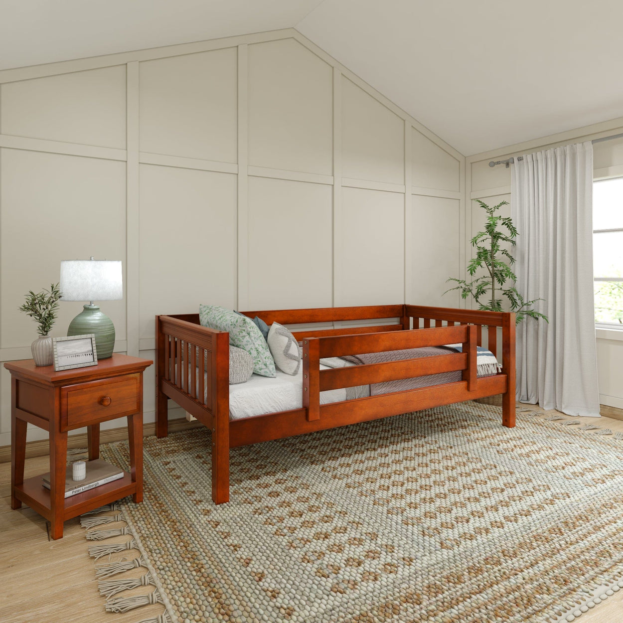 Wooden toddler bed in cozy bedroom with side table, decorative rug, and natural light.