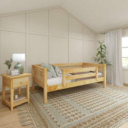 Cozy bedroom with wooden daybed, elegant decor, and natural light streaming through a window.