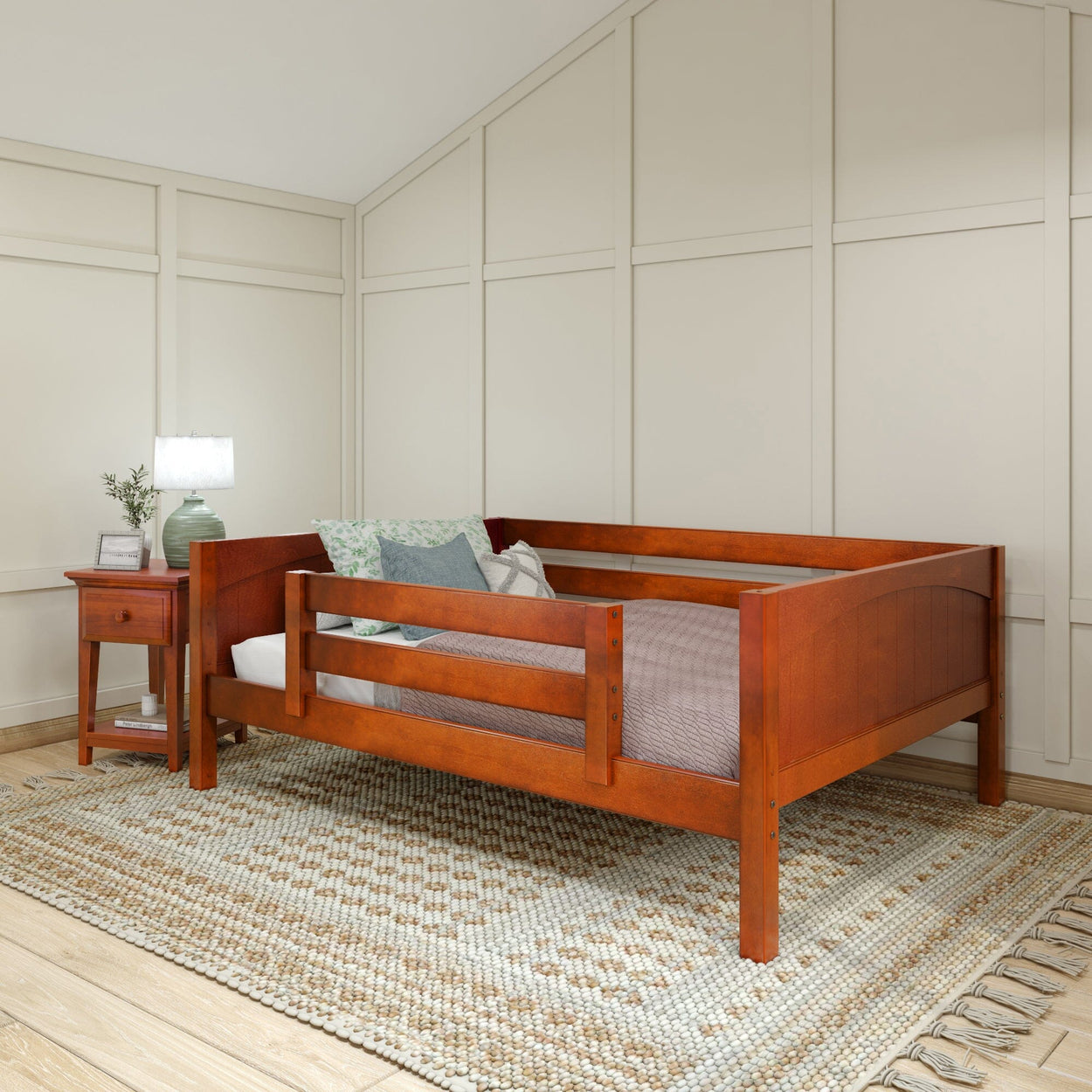 Cherry wood daybed with pillows in a modern bedroom setting.