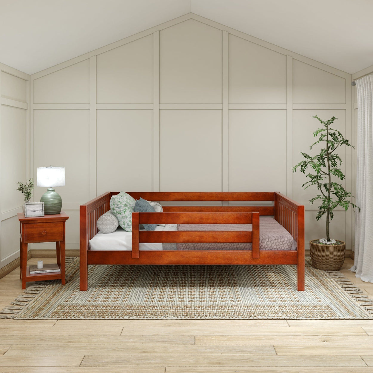 Wooden daybed with pillows in cozy bedroom featuring a side table and potted plant.