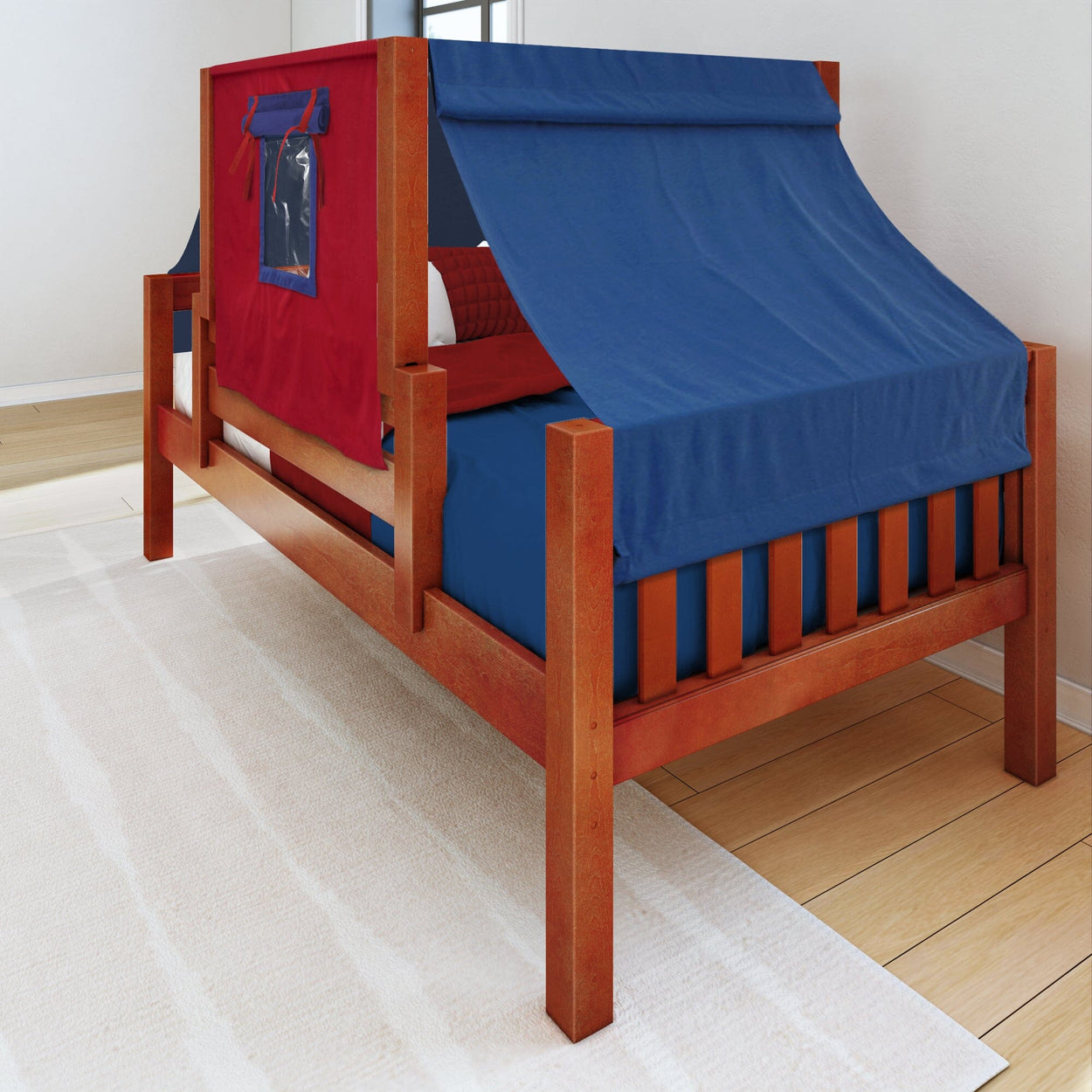 Red and blue wooden children's bed with canopy tent design in a bright bedroom.