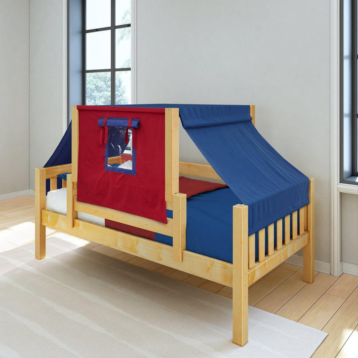 Wooden kids bed with blue and red tent canopy in a bright room.