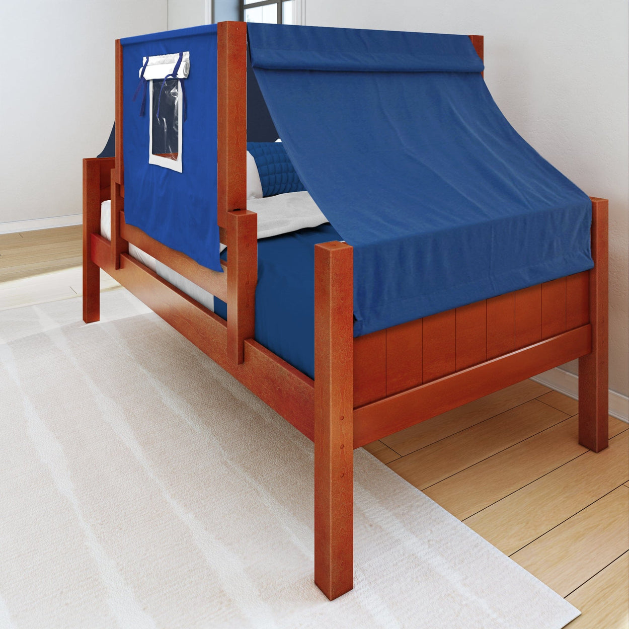 Wooden twin bed with a blue tent canopy in a modern bedroom.