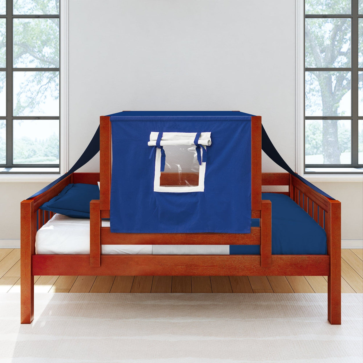 Wooden daybed with blue tent attachment and window in a modern, naturally lit bedroom.