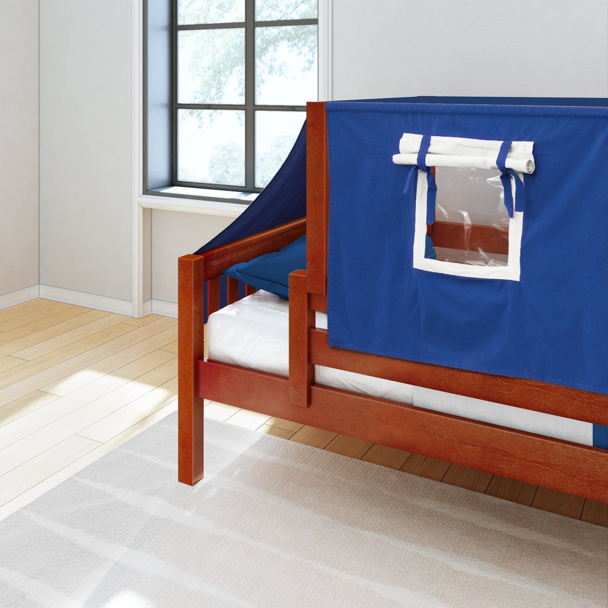 Wooden bed with blue tent canopy in bright bedroom.