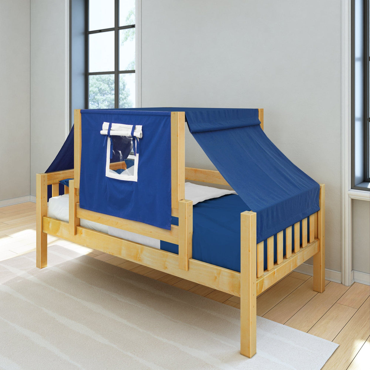 Wooden child's bed with blue tent-style canopy.