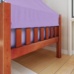 Wooden bed frame with purple fitted sheet in a well-lit bedroom.