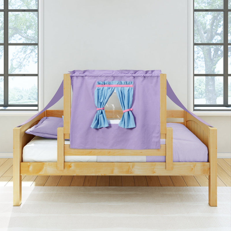 Natural wood single children's bed with purple playhouse canopy and blue tie-back curtains, lavender bedding and sunlit windows in a modern kids' bedroom