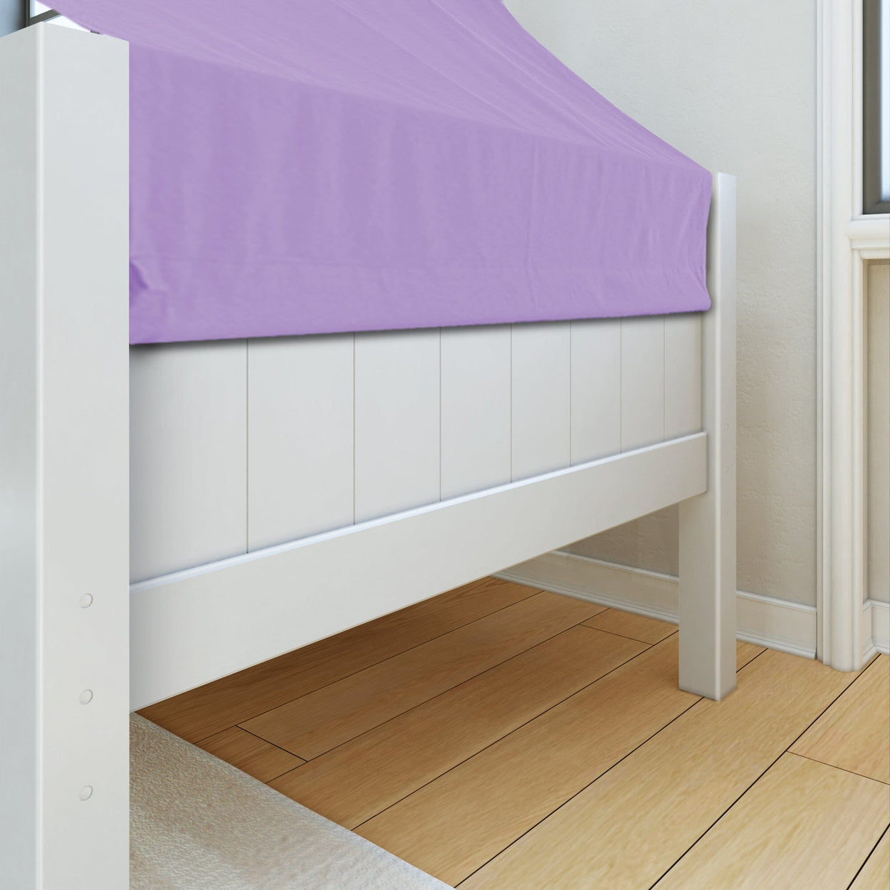 White wooden bed frame with purple canopy in a cozy bedroom setting.
