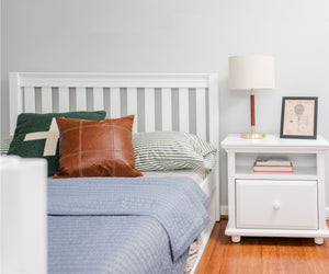 Queen traditional starter bed with white slats and matching nightstand.