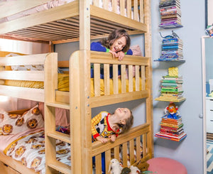 Twin triple bunk bed in natural solid hardwood in small shared kids bedroom