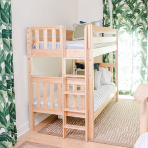 Natural twin xl over twin xl bunk bed with green curtains in the room
