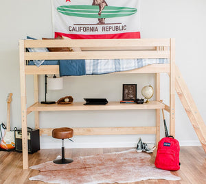 Corner loft bed with bookcase in boys room with underbed lounge area