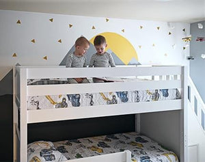 Twin over twin bunk bed in white in boys shared bedroom