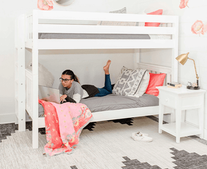 Solid hardwood twin over twin bunk bed in teen girl room with nightstand
