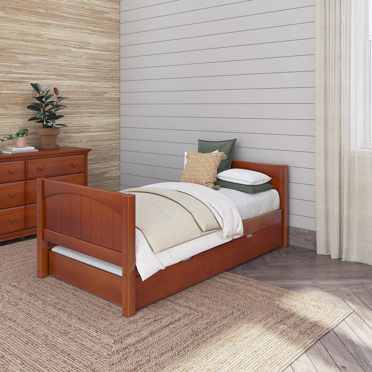 Wooden twin bed with storage drawer in cozy bedroom featuring beige walls and natural fiber rug.