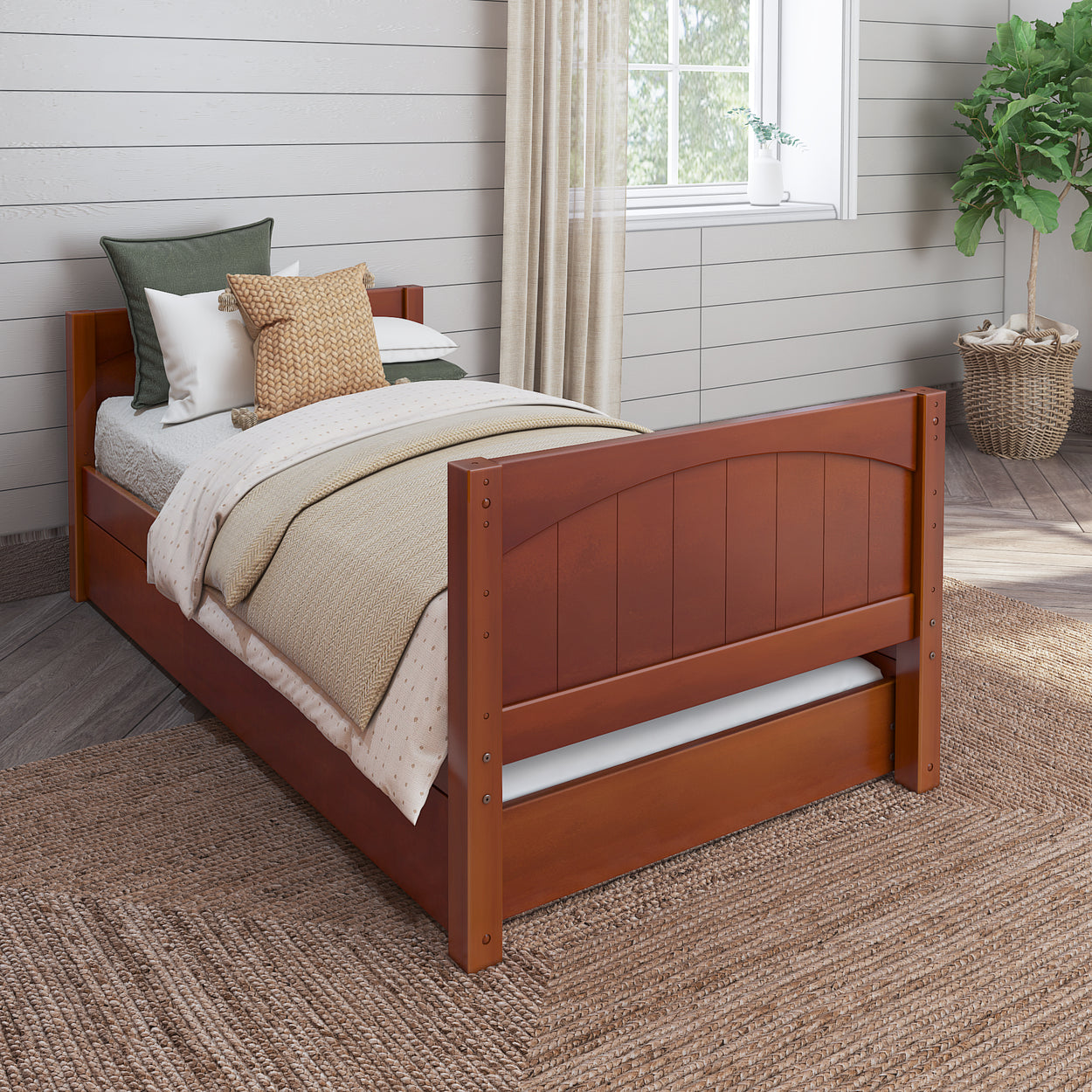 Wooden twin bed with cozy bedding in a sunlit bedroom featuring neutral decor and a potted plant.