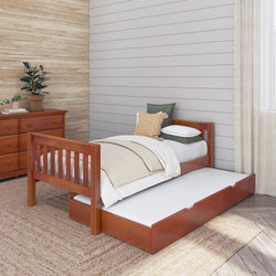 Single wooden bed with trundle and cozy bedding in a modern bedroom setting.