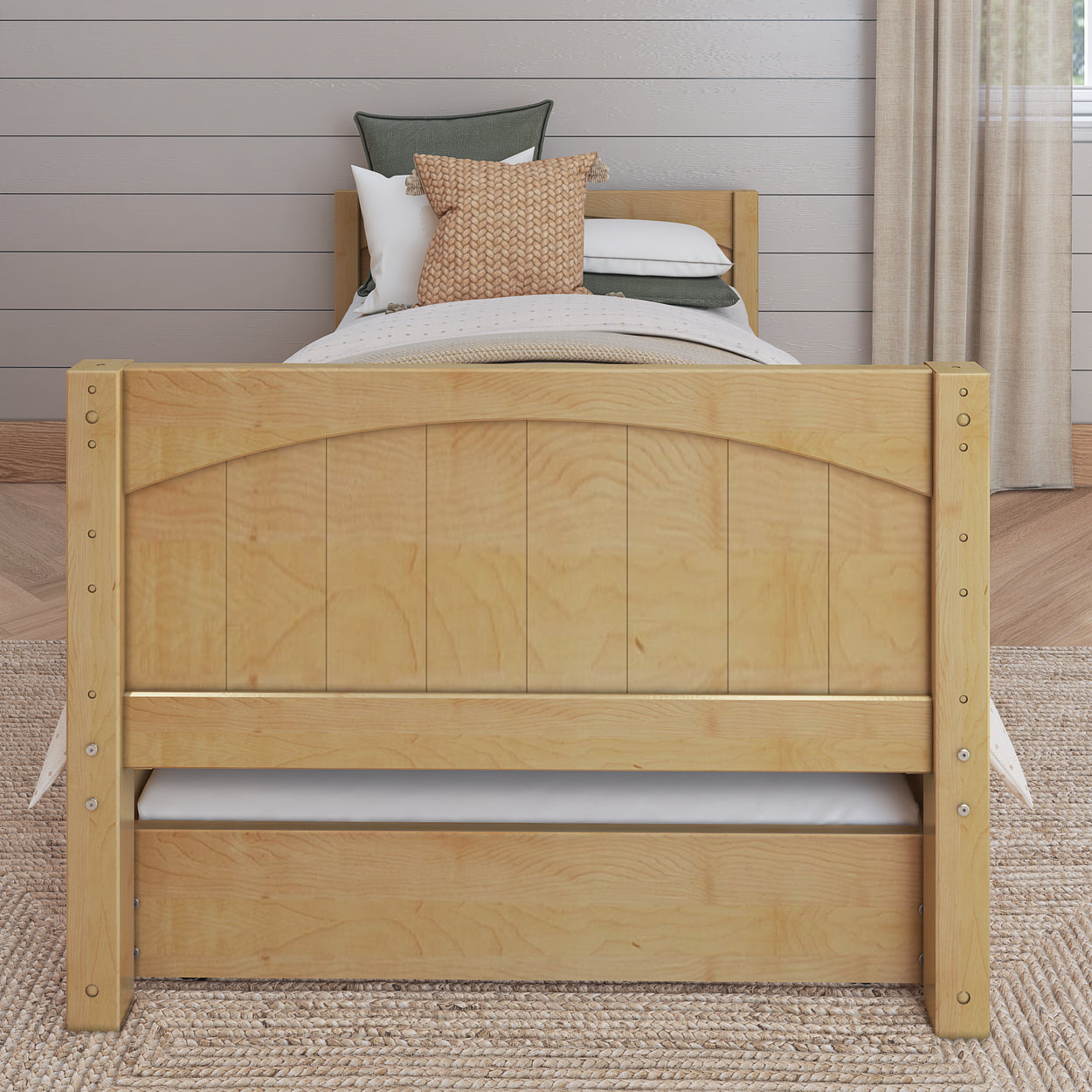 Wooden twin bed frame with storage drawer in cozy bedroom setting.