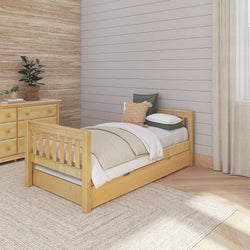Single wooden bed with beige bedding in a cozy, modern bedroom with wood accents.