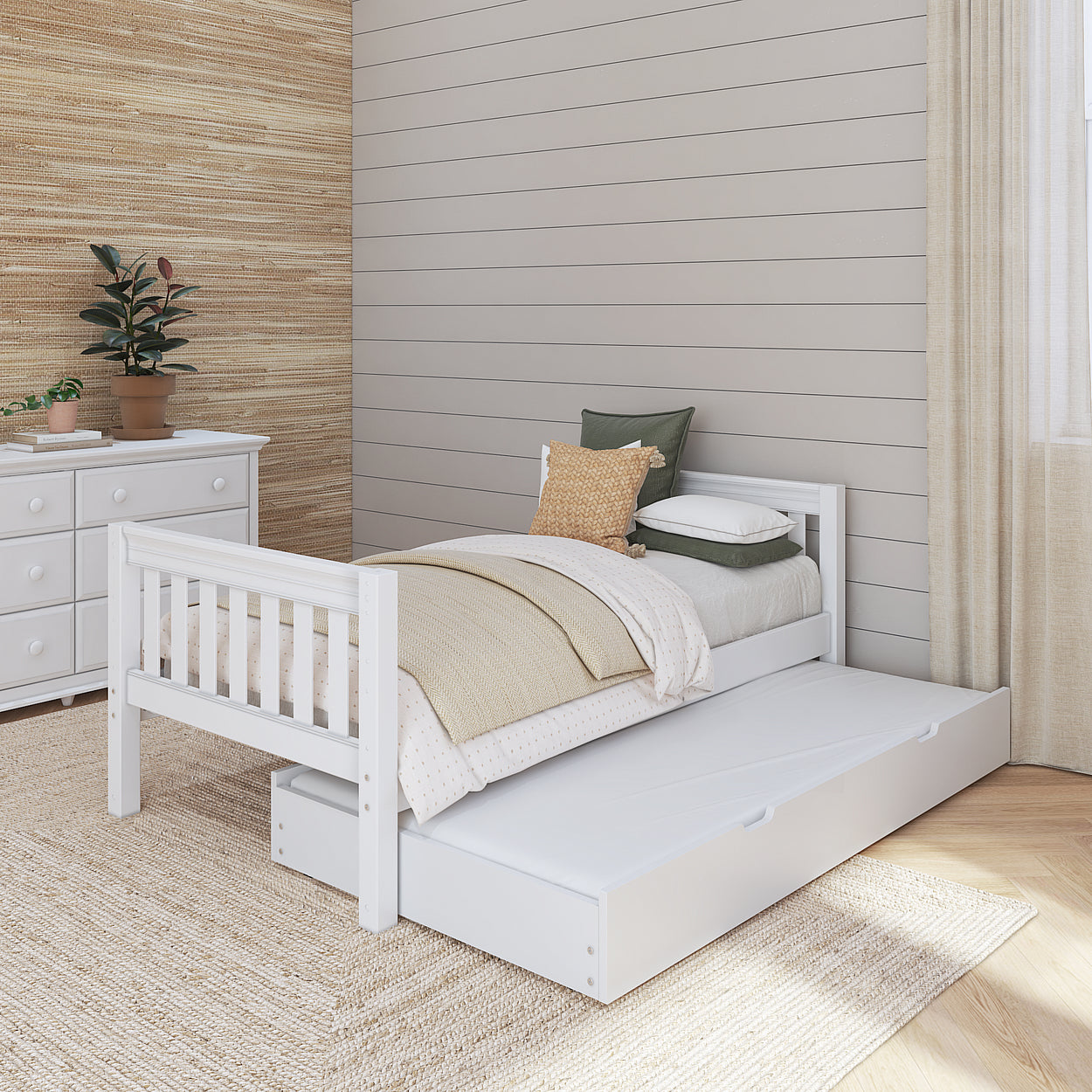 White wooden daybed with a pull-out trundle in a cozy bedroom with beige decor and potted plant.