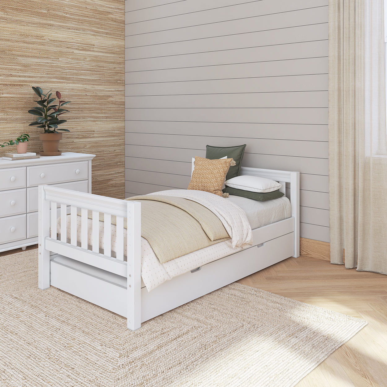 Cozy bedroom with a white wooden twin bed and dresser, featuring green and beige decor for a serene atmosphere.