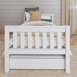 White wooden bed with storage drawers and cushion accents in a stylish bedroom.