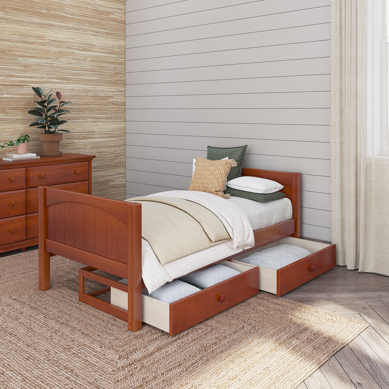Single wooden bed with under-bed storage drawers in a cozy bedroom with natural wood furniture and neutral decor.