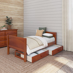 Single wooden bed with under-bed storage drawers in a cozy bedroom with natural wood furniture and neutral decor.