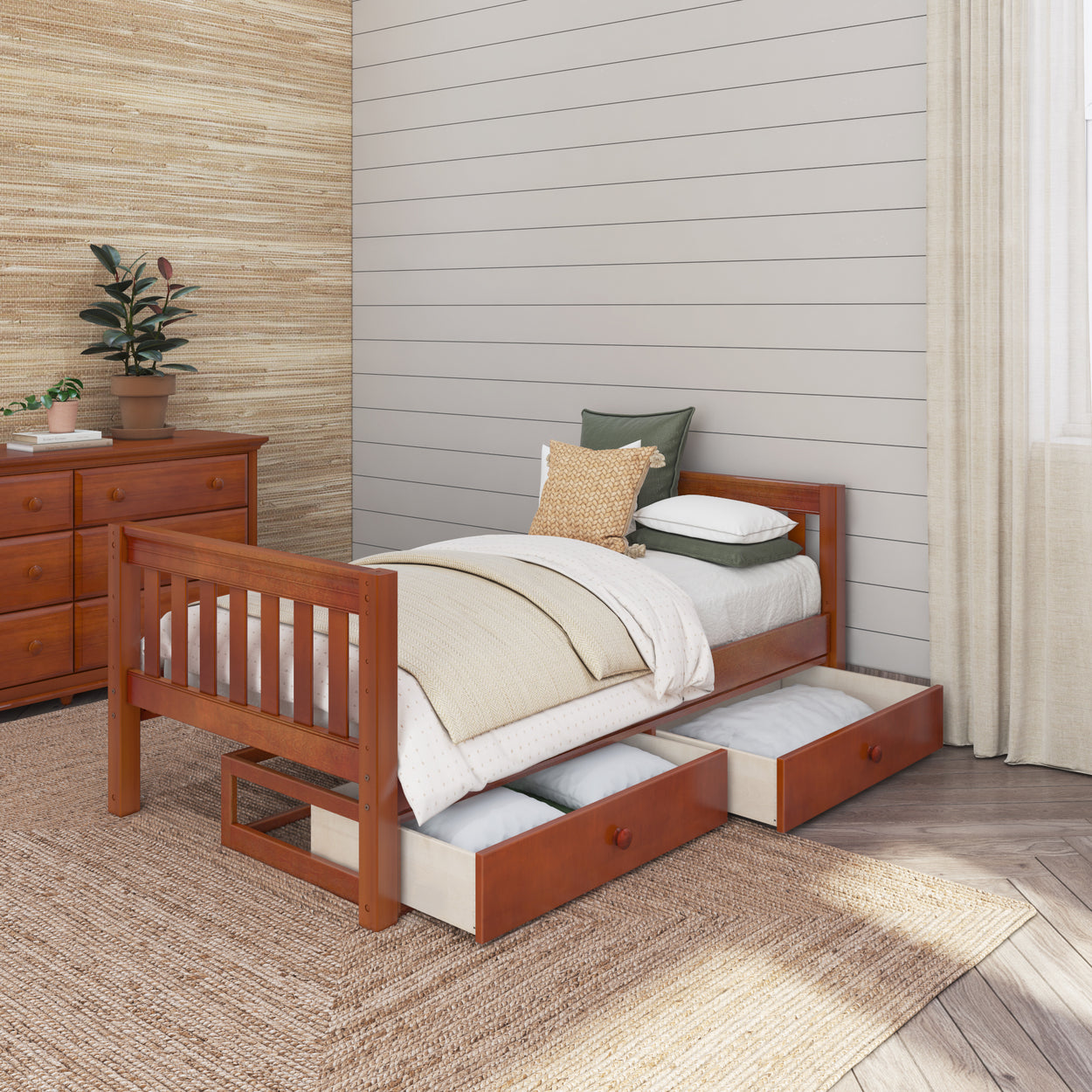 Wooden twin bed with storage drawers and cozy pillows in a modern bedroom setting.
