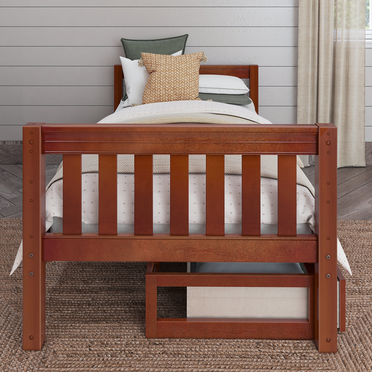 Wooden twin bed with white bedding and assorted pillows in a cozy, modern bedroom setting.