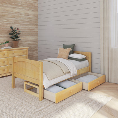 Wooden single bed with under-bed storage drawers, cozy bedding, and a modern dresser in a stylish bedroom setting.