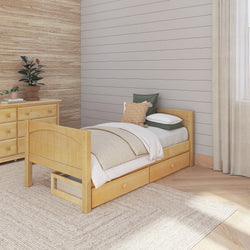 Wooden twin bed with storage drawers in a cozy bedroom with neutral decor.