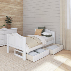 Modern wooden bedroom with a white single bed featuring under-bed storage drawers on a cozy carpet, accented by neutral decor and a potted plant.