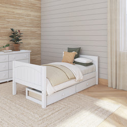 White wooden bed with storage drawers in a modern bedroom with neutral decor and natural wood accents.
