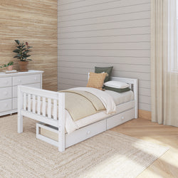 White wooden twin bed with storage drawers in a modern bedroom with neutral decor.